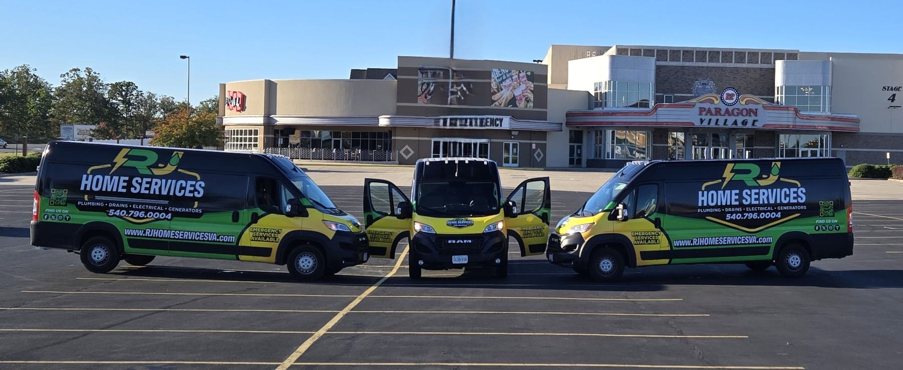 Three RJ Home Services vans parked side by side, doors open