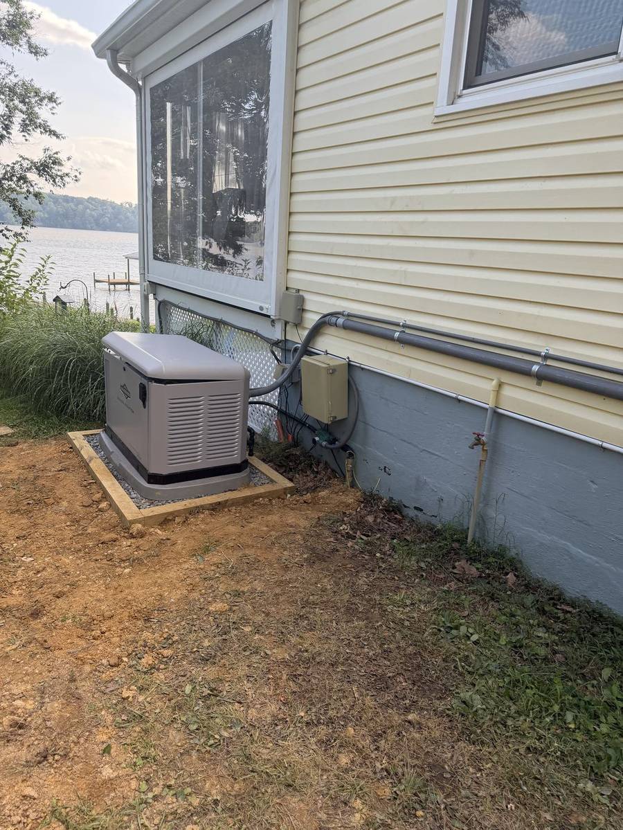 Standby generator beside a lakeside home