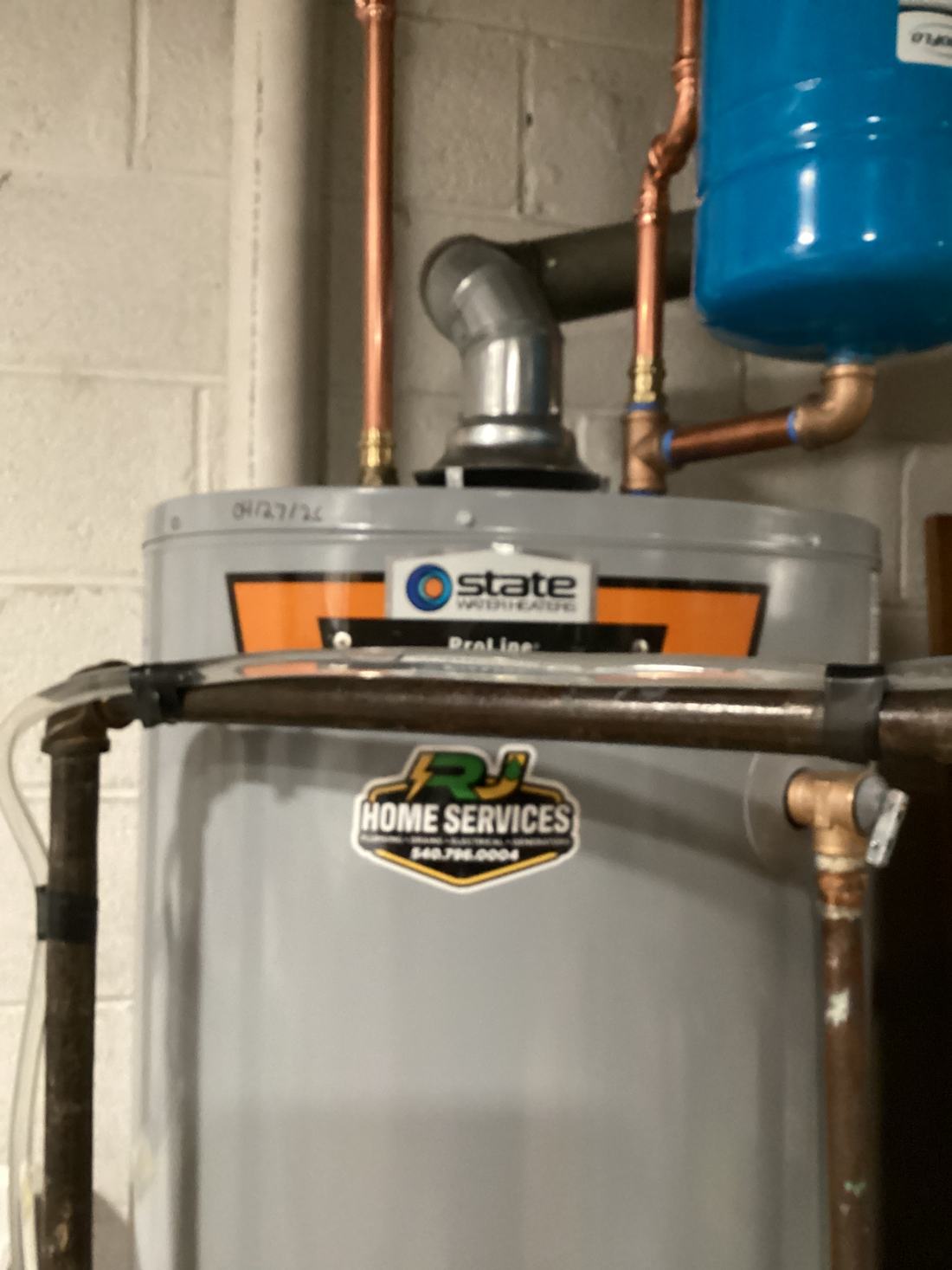 Water heater installed by RJ with the RJ sticker on the tank